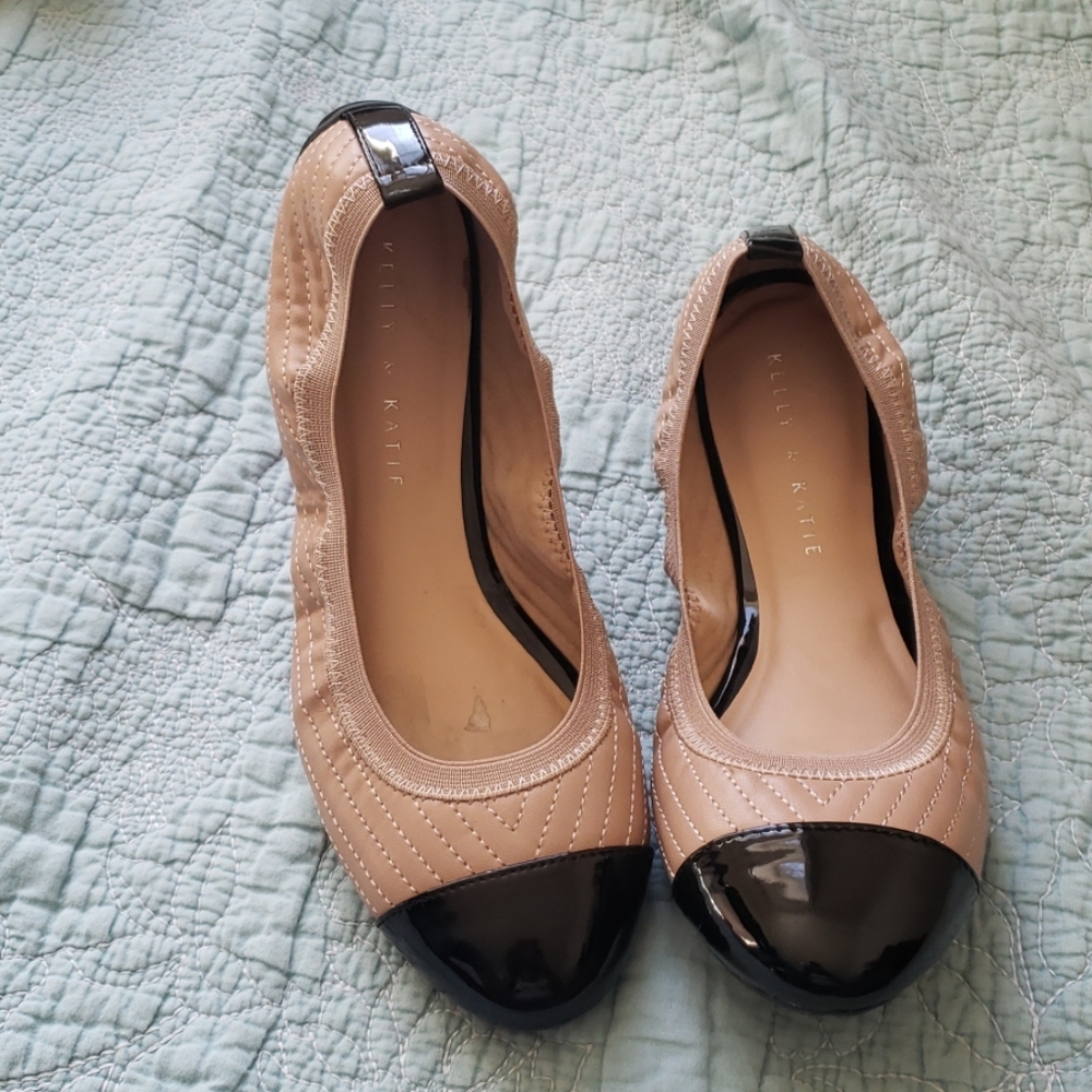 Tan and black ballet flats